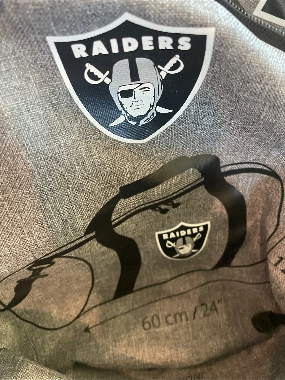 Northwest Gray Duffel Bag with Black Straps and Raiders Logo